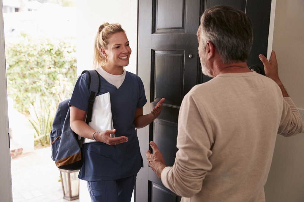 nurse being welcomed into a home
